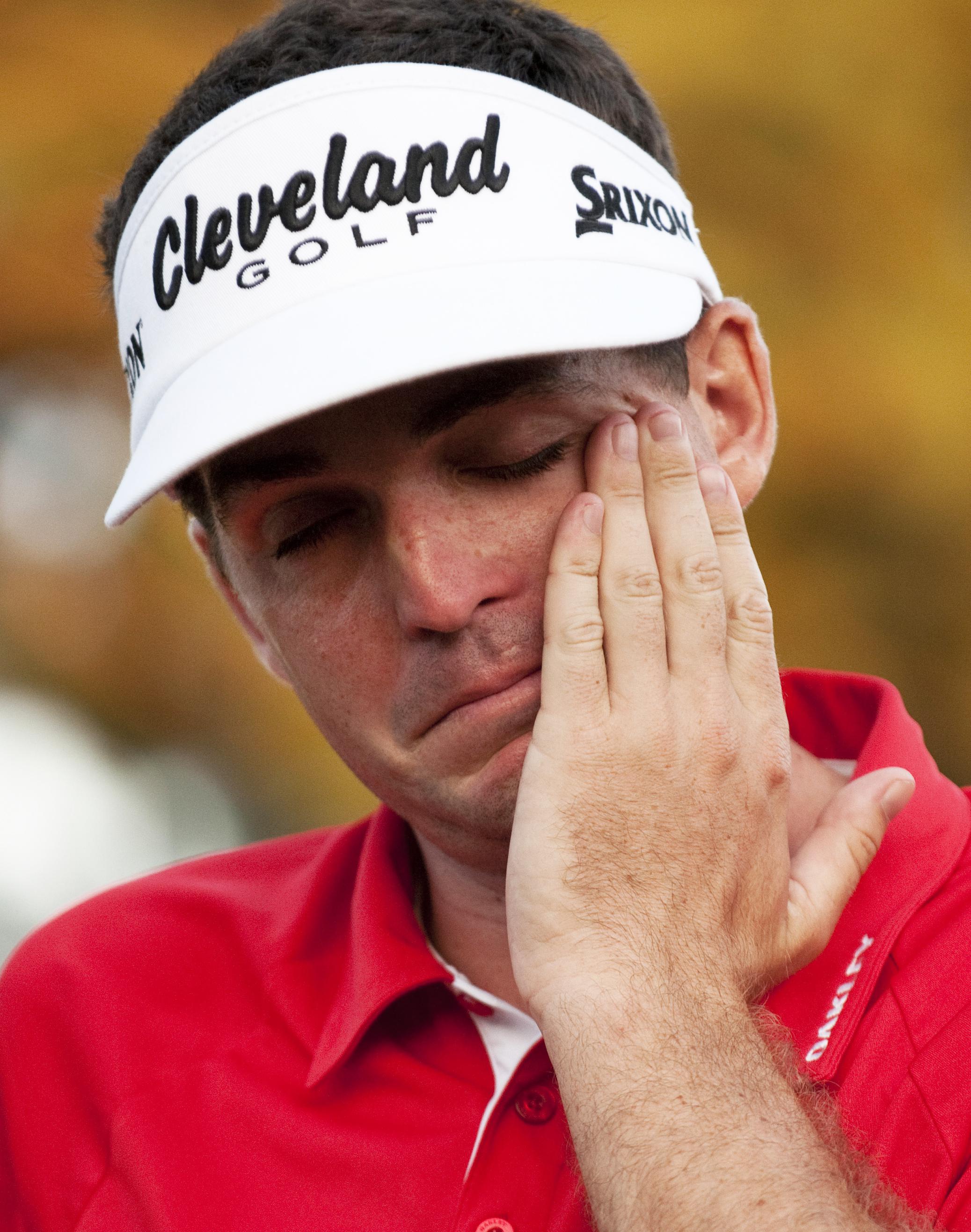 Keegan Bradley of the US cries as he rec
