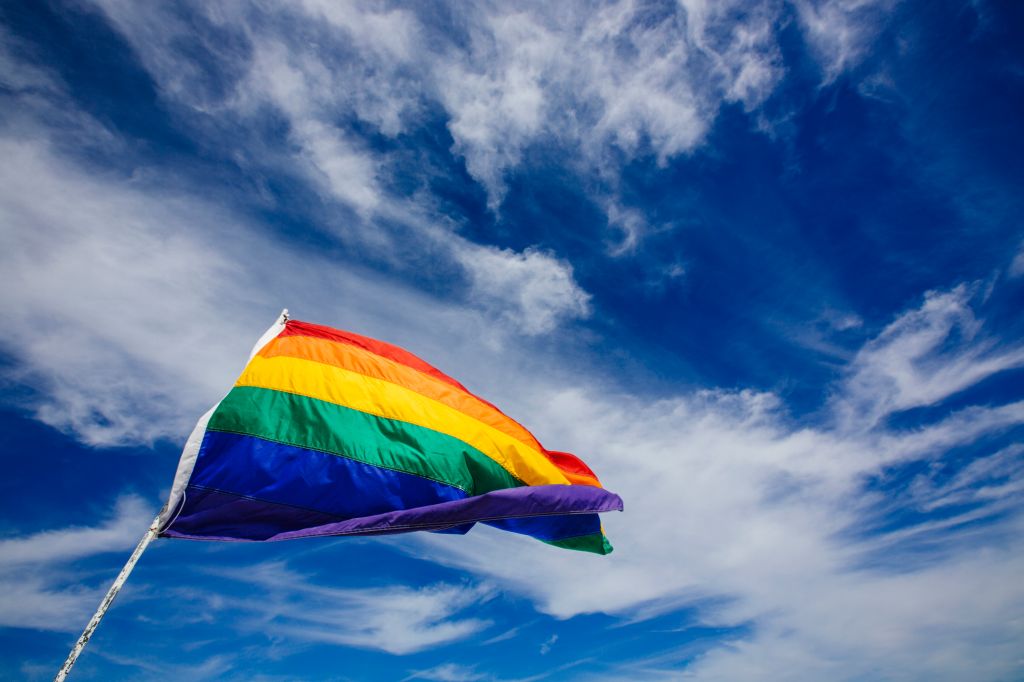 Rainbow flag waiving in the wind in South Beach, Miami