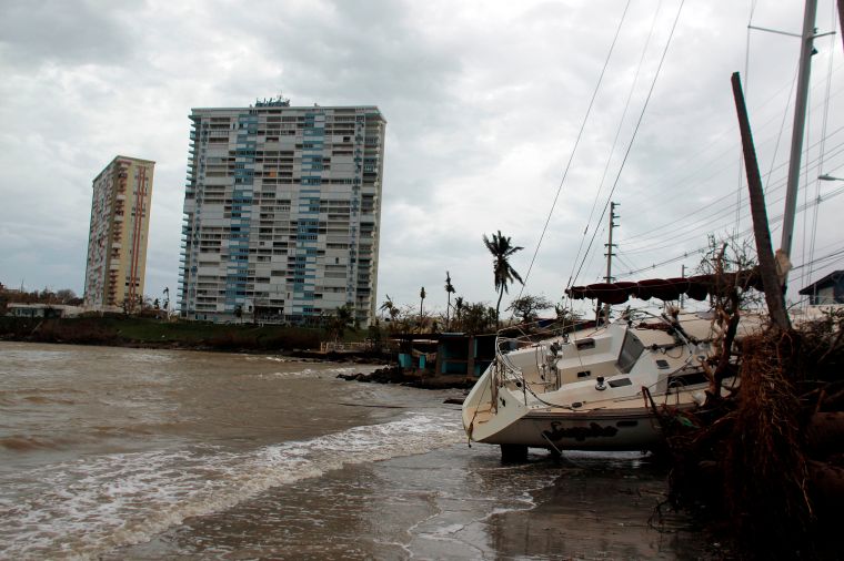 Fajardo, PR: A damaged sail boat washed ashore following Hurricane Maria.