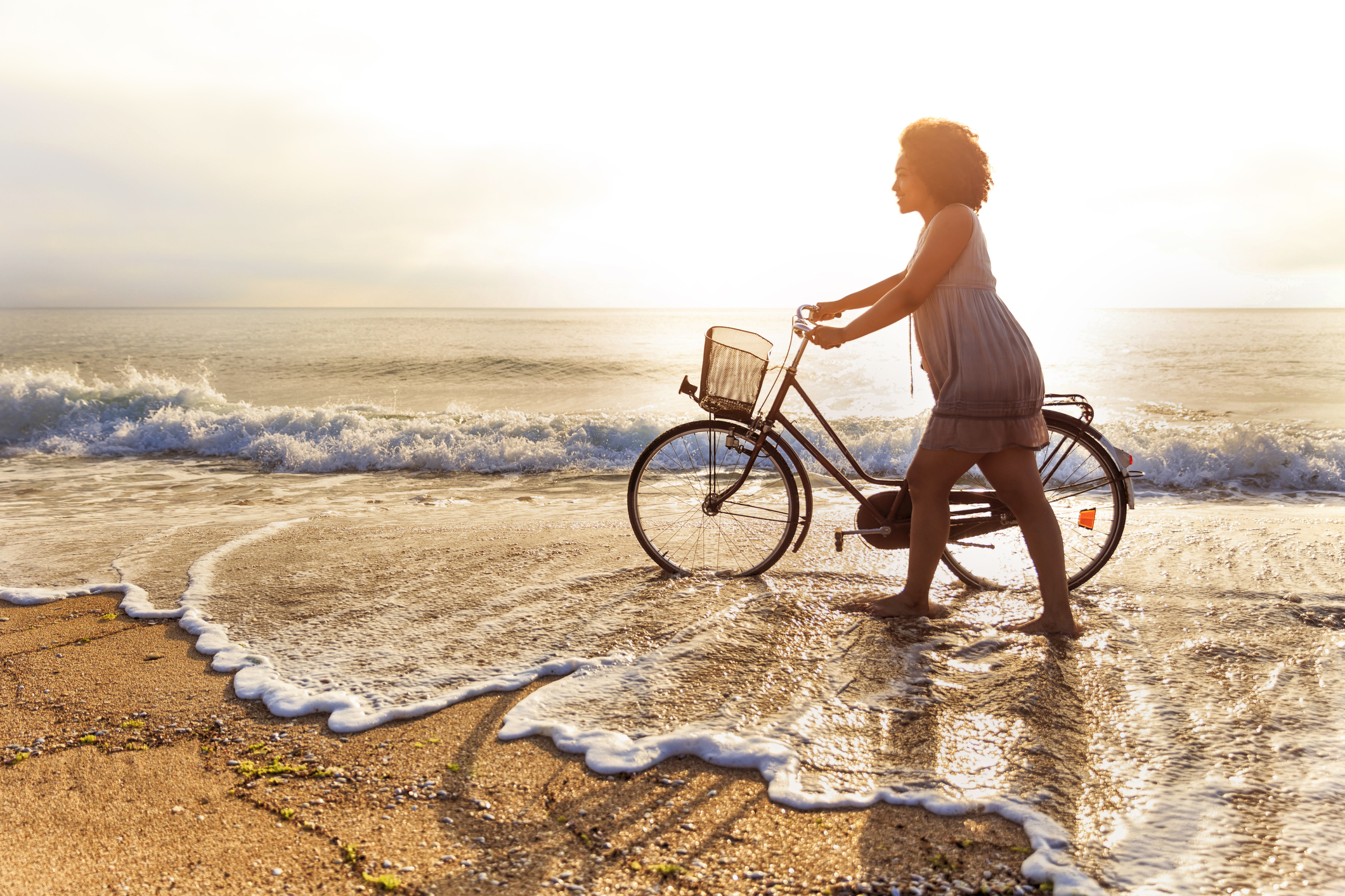 Woman riding on beach