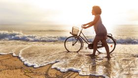 Woman riding on beach