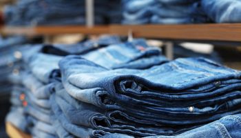 jeans on shelves in a clothing store