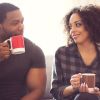 Afro american couple drinking coffee at home