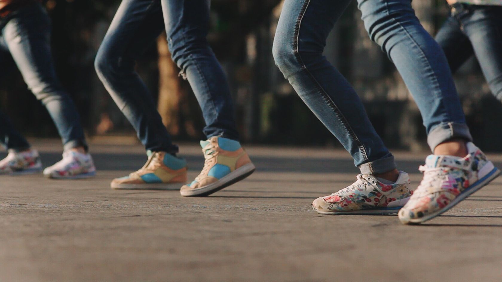 Low Section Of Women Dancing On Footpath