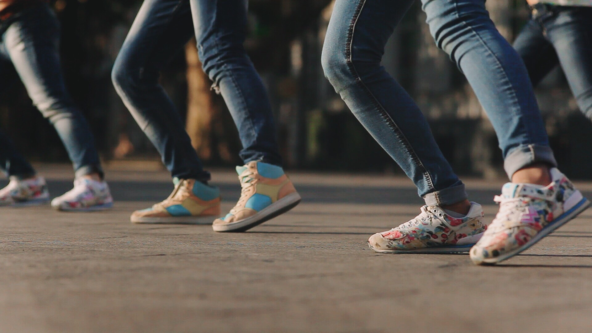 Low Section Of Women Dancing On Footpath