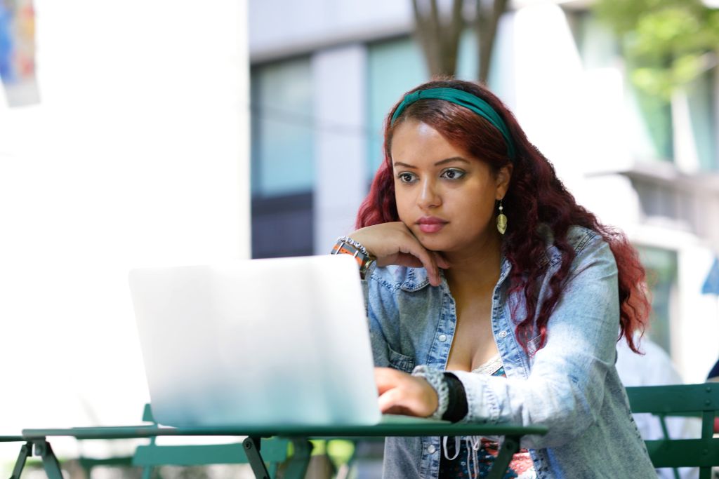 Young woman working outside