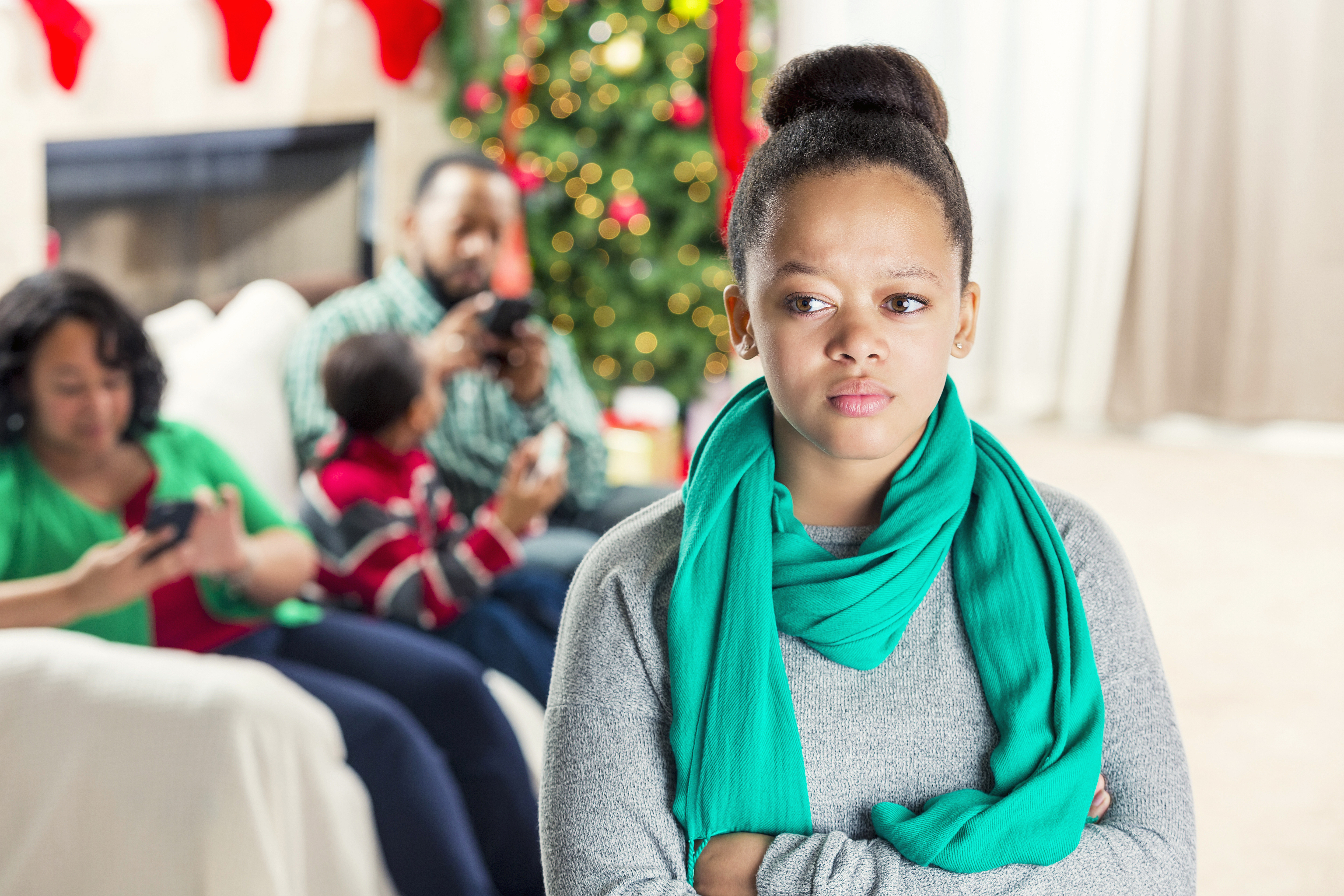 Teenage girl is ignored by family at Christmastime