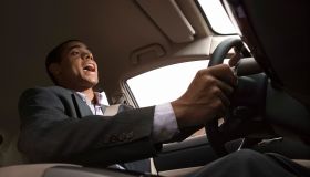 Businessman singing while driving