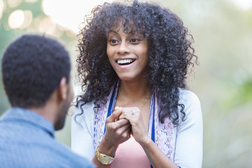Beautiful mixed race woman accepts boyfriend's marriage proposal