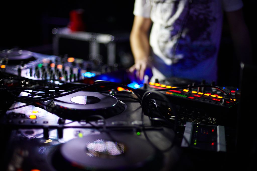 Closeup of a DJ's turntable and soundboard