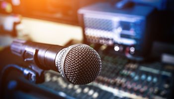 Microphone over the Abstract blurred on sound mixer out of focus background