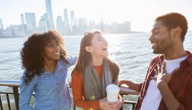 Young adults laugh while vacationing together