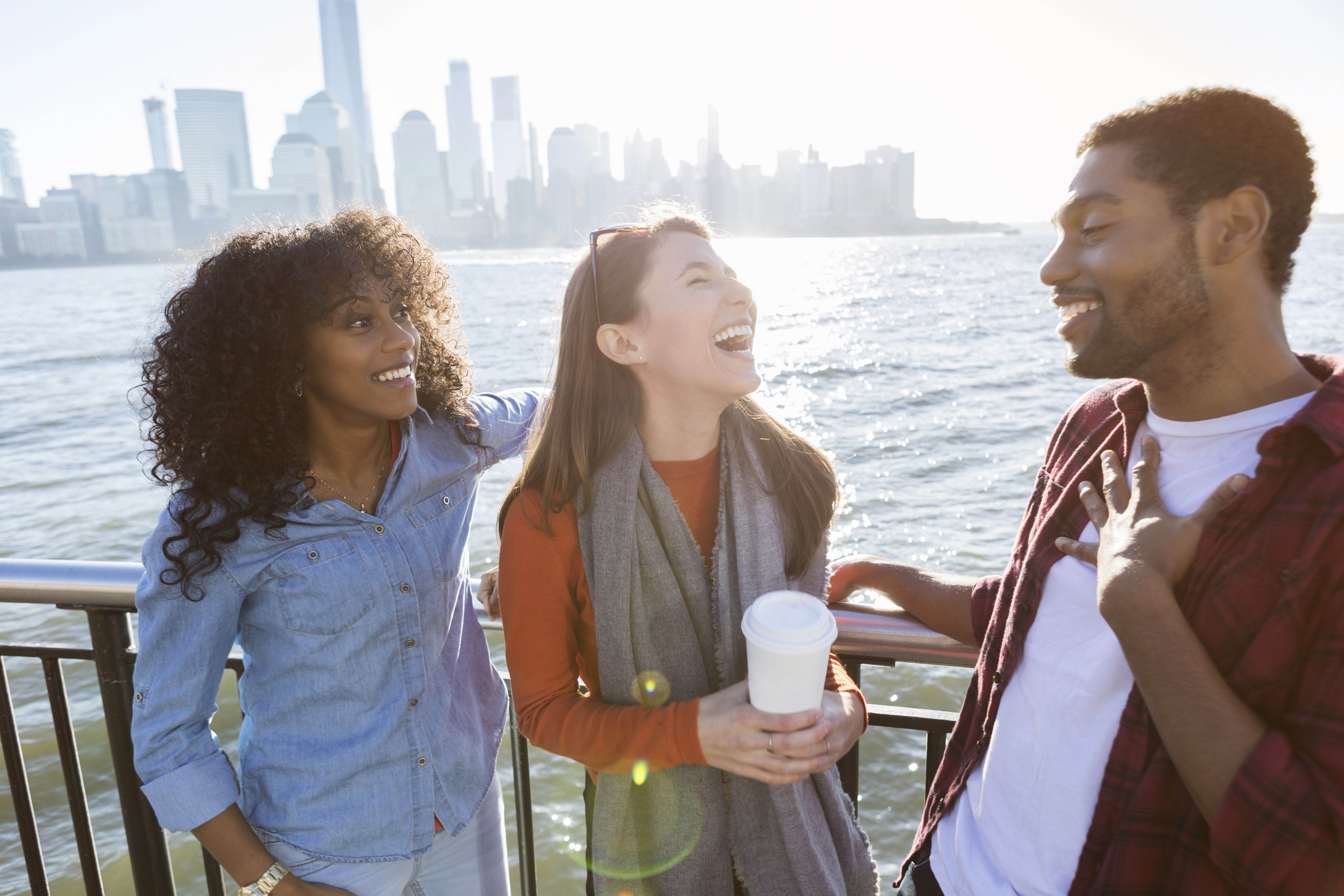 Young adults laugh while vacationing together