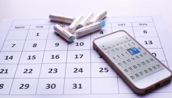 Clean white tampons, mobile phone and Calendar