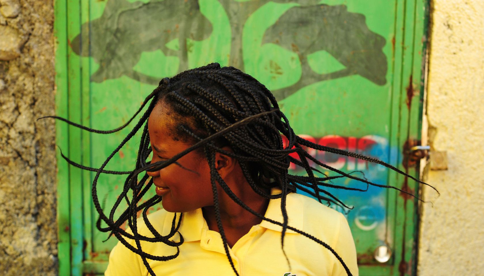 Girl dancing and shaking her braids