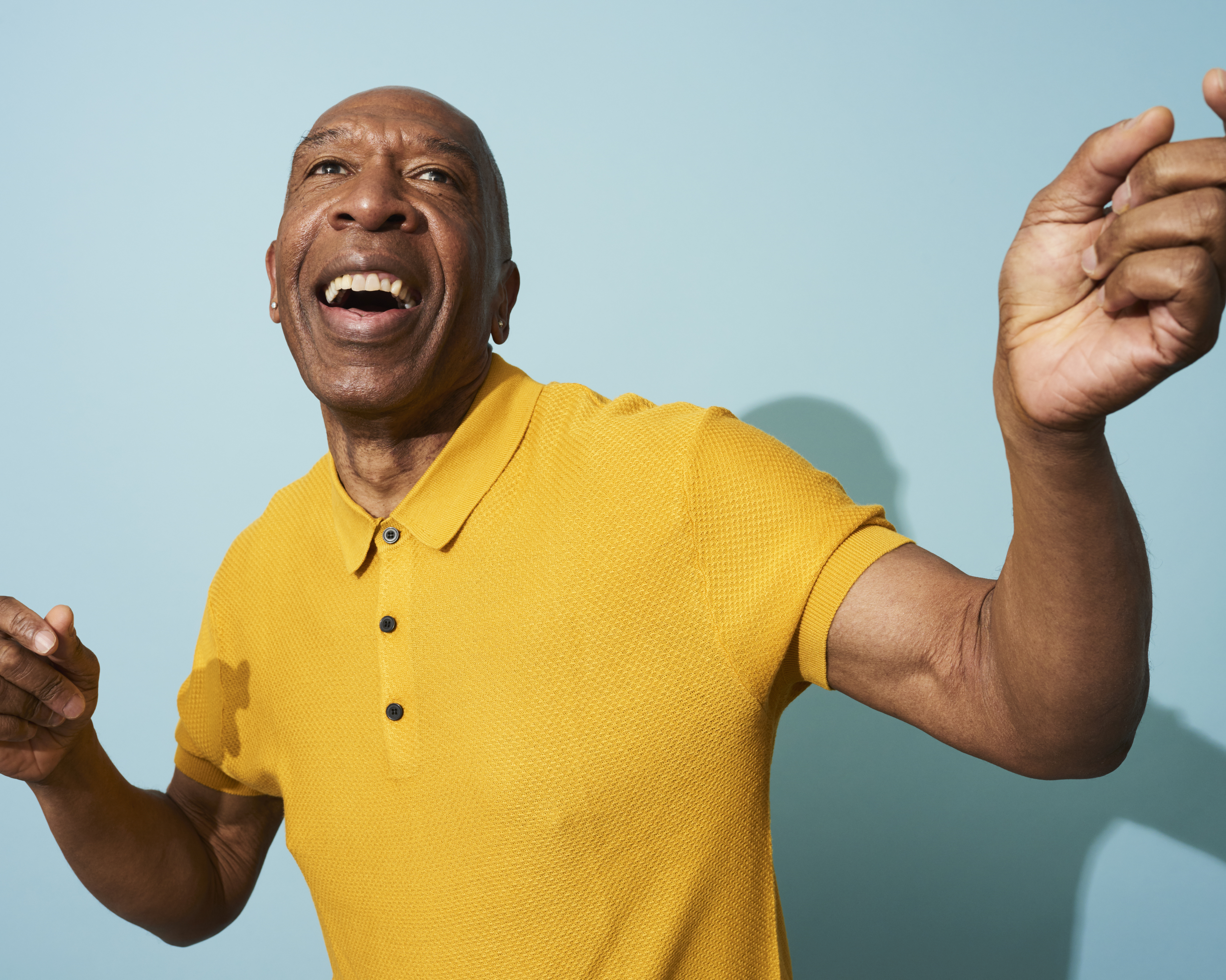 Portrait of a mature man dancing, smiling and having fun