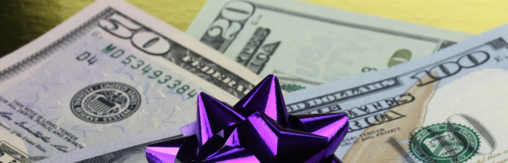 US cash with a gift bow