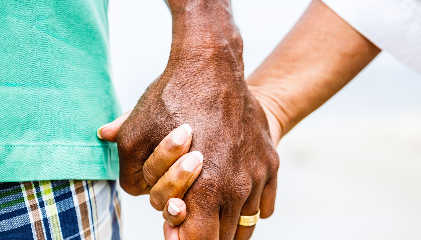 Senior African American couple holding hands