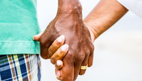 Senior African American couple holding hands