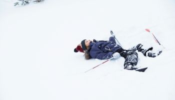 Girl lying in snow