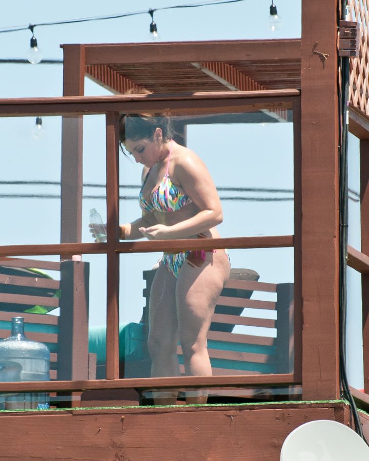 3. Deena Cortese has a wardrobe malfunction at the beach as she and the guys from Jersey Shore escape the heat by taking a dip in the ocean. || Photo Credit: Splash & INF