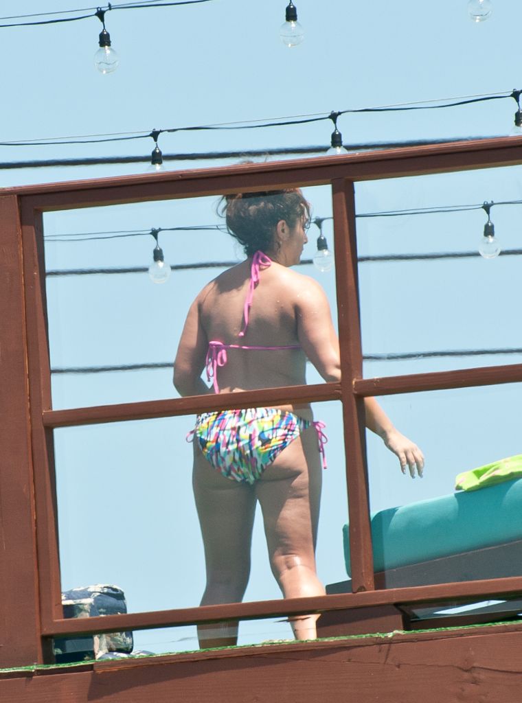 8. Deena Cortese has a wardrobe malfunction at the beach as she and the guys from Jersey Shore escape the heat by taking a dip in the ocean. || Photo Credit: Splash & INF