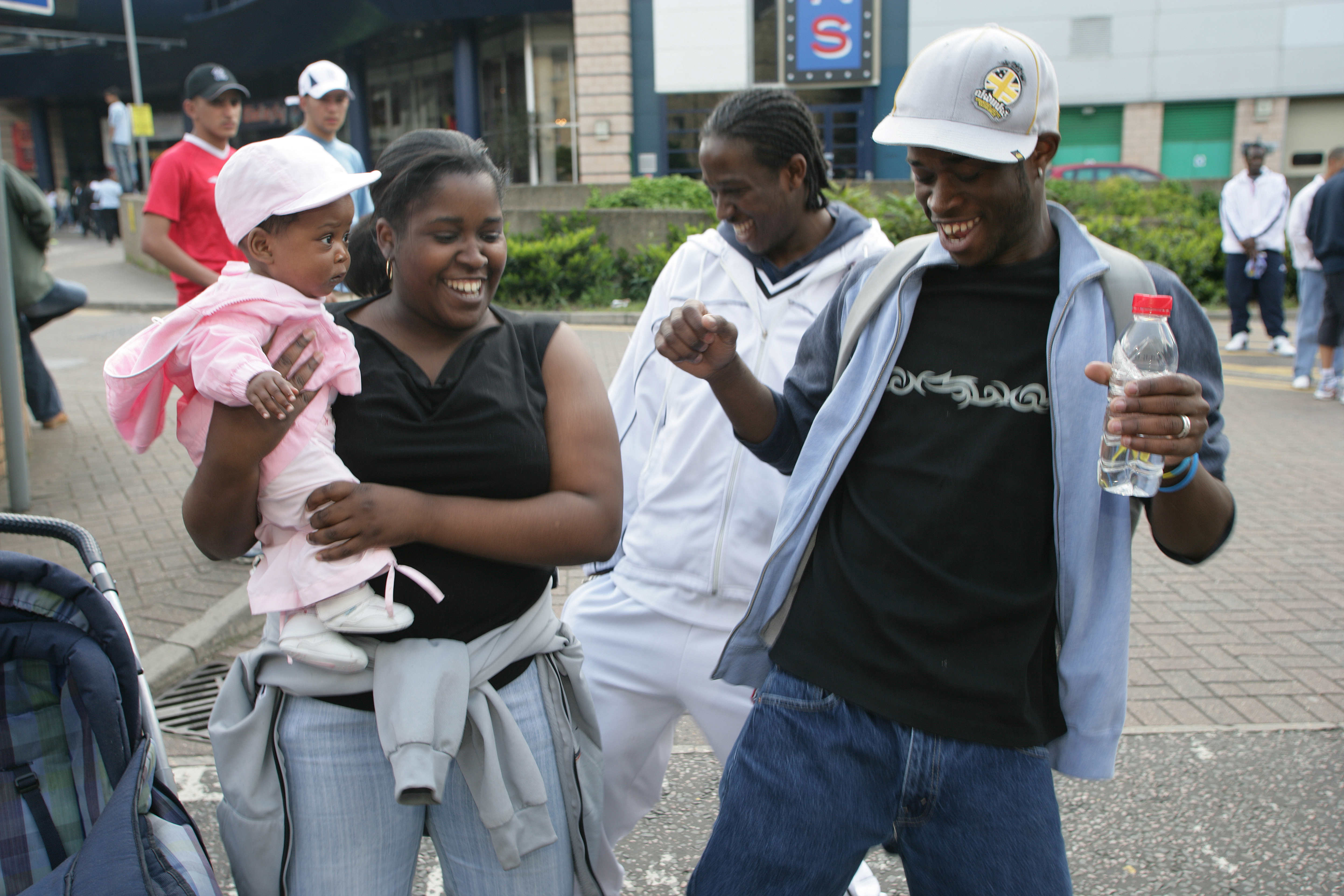 Family in party spirit for the Luton Carnival, Luton, Bedfordshire, England.