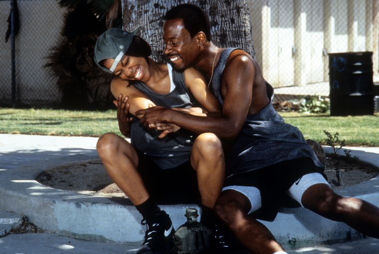 Regina Hall and Martin laugh it up.