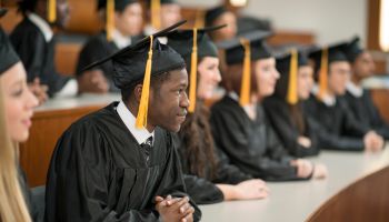 University Graduates Sitting in a Row