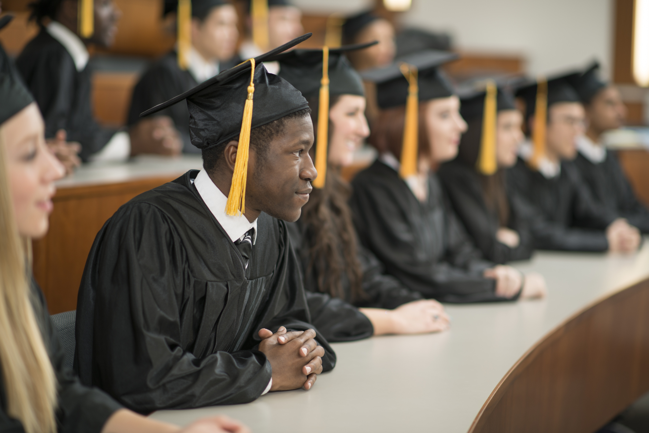 University Graduates Sitting in a Row