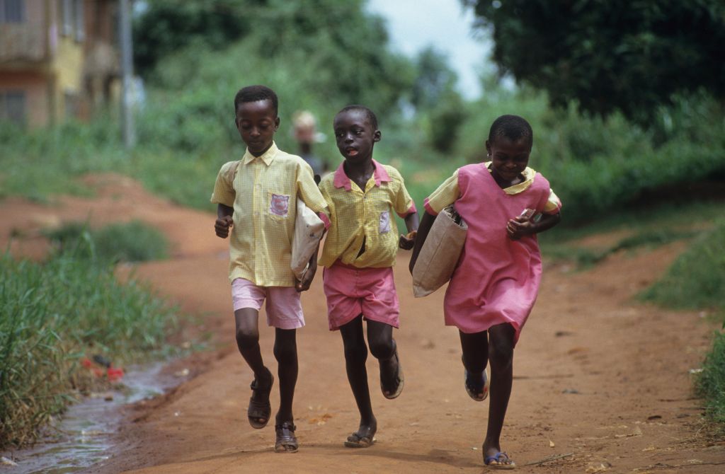 CHILDREN GOING TO SCHOOL, NIGERIA. Primary school in Benin city.