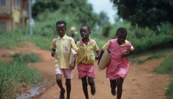 CHILDREN GOING TO SCHOOL, NIGERIA. Primary school in Benin city.
