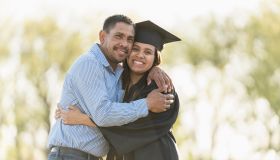 Father and daughter hugging at graduation