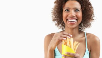 Woman Eating French Fries