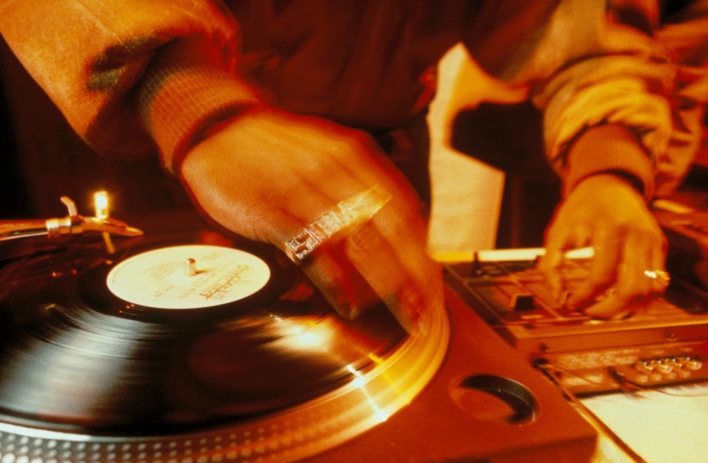Close-up of Jungle Brothers DJ, Sammy B scratching in the UK, 1990s