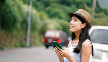 Woman using mobile phone navigation