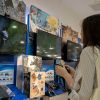 A young girl is experiencing PlayStation 4 in a Sony store...
