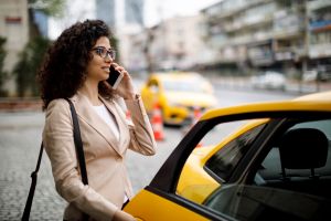 Businesswoman taking a taxi ride