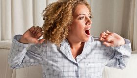 Woman stretching and yawning