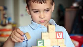 Autistic boy building with blocks
