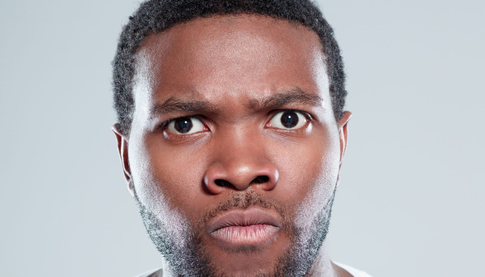 Young afro american man looking angry