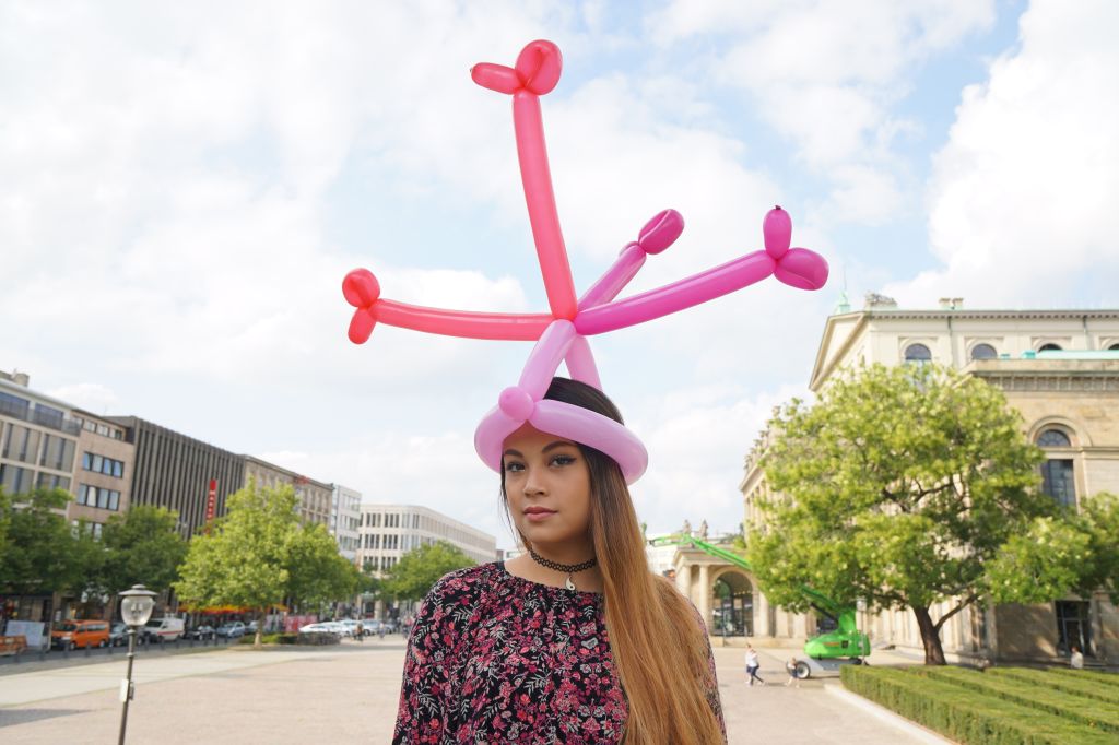 Woman Wearing Balloon Hat