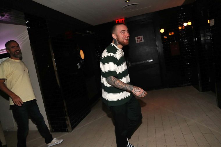 Mac is all smiles at his album listening party in July.