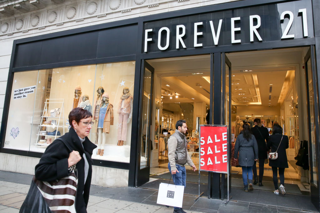 Shoppers are seen outside Forever 21 store on London's...