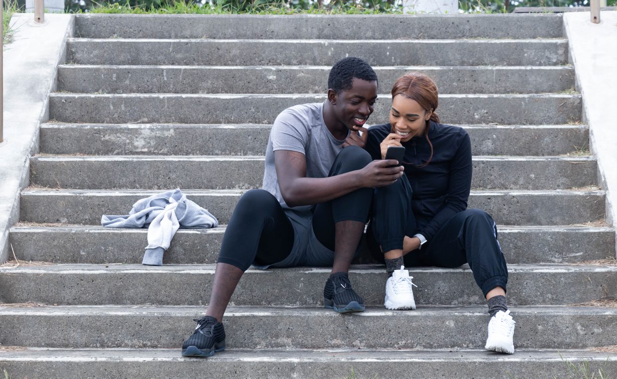Checking Phone on the Stairs