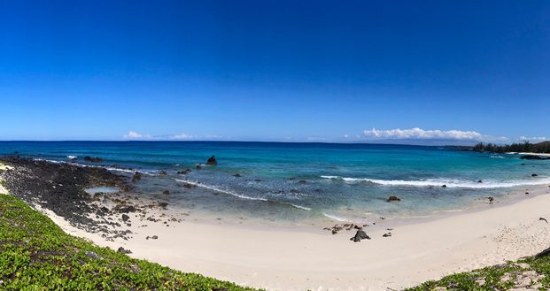 Panoramic View Of Beach Against Clear Blue Sky