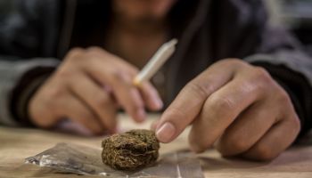 Marijuana joint in the hand, drugs concept
