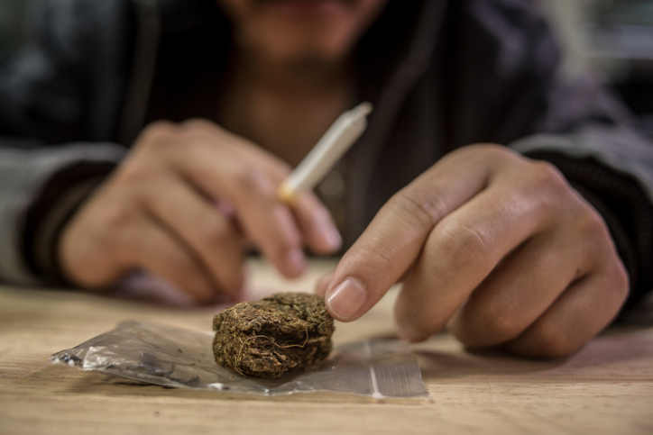 Marijuana joint in the hand, drugs concept
