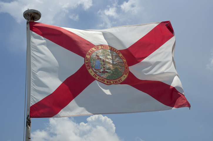 Florida State flag flying from boat.