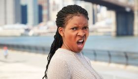 Black woman with disgusted attitude at waterfront